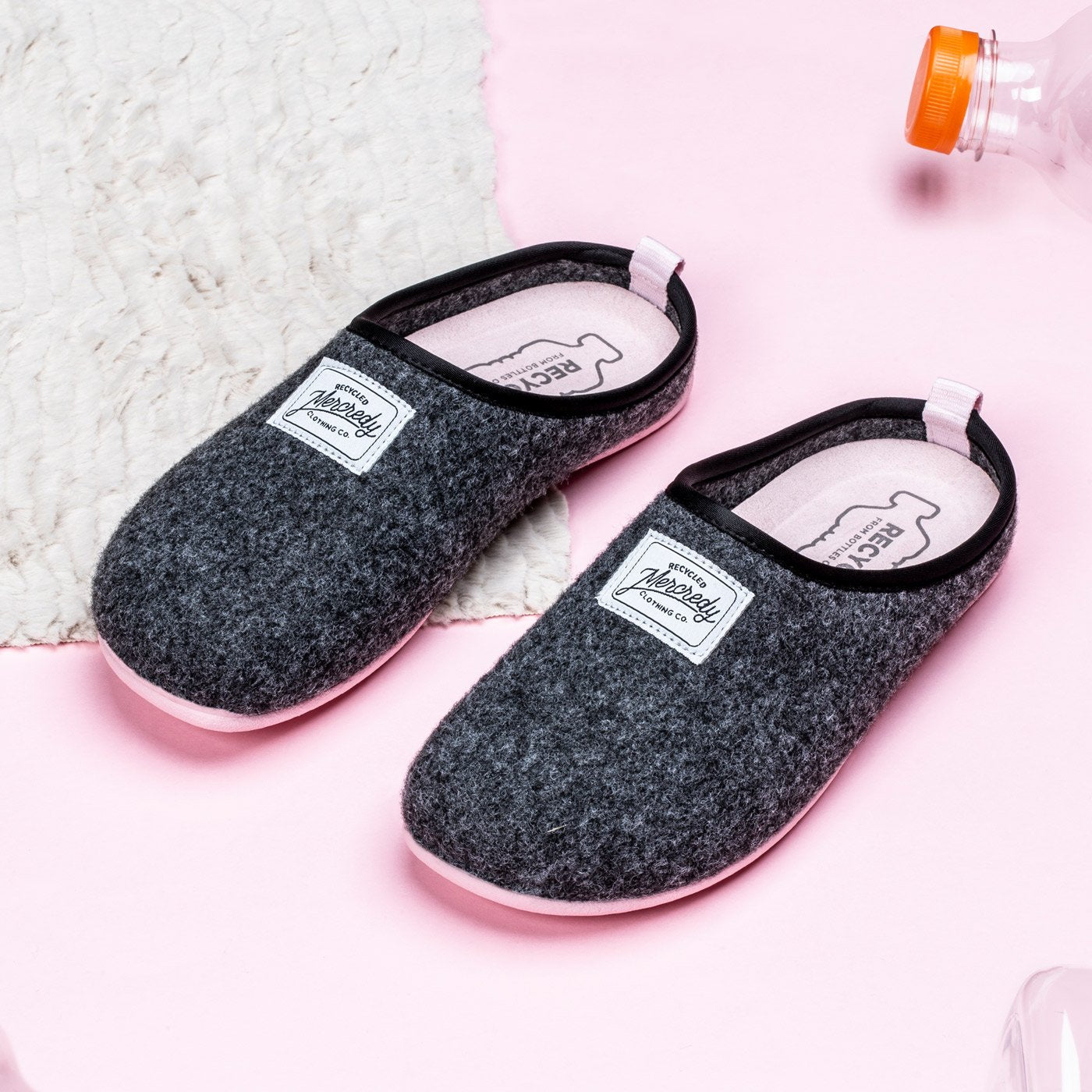 Women's Mercredy Wool Slippers with a Rubber Sole, made from Recycled Plastic Bottles, Black upper & Pink sole.